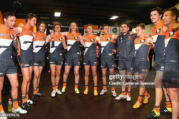 Giants players sing their team song after winning the round 19 AFL match between the Greater Western Sydney Giants and the Essendon Bombers at...