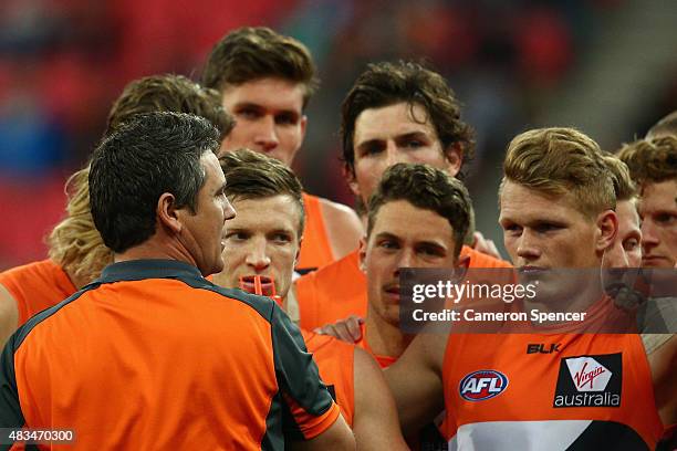 Giants coach Leon Cameron talks to his players during the round 19 AFL match between the Greater Western Sydney Giants and the Essendon Bombers at...