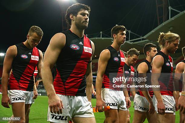 Bombers players look dejected after losing the round 19 AFL match between the Greater Western Sydney Giants and the Essendon Bombers at Spotless...