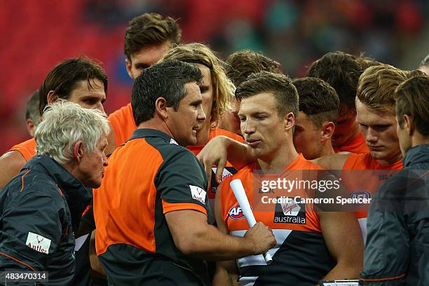 Giants coach Leon Cameron talks to his players during the round 19 AFL match between the Greater Western Sydney Giants and the Essendon Bombers at...