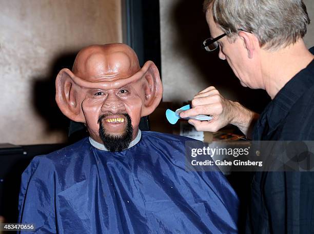 Bill Arucan of California, gets make-up done by make-up artist Tim Vittetoe during the 14th annual official Star Trek convention at the Rio Hotel &...