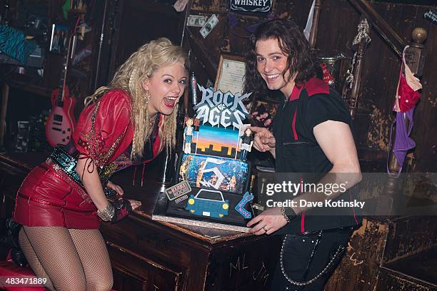 Aaron C. Finley and Kate Rockwell perform at the "Rock Of Ages" 5th Anniversary On Broadway celebration at Helen Hayes Theatre on April 8, 2014 in...