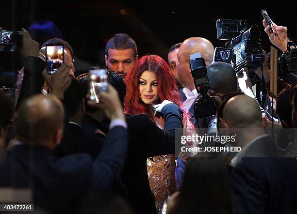 Lebanese pop star Haifa Wehbe arrives for the Premiere of he movie 'Halawet Rooh' at a movie theatre in the town of Dbayeh, North of Beirut on April...