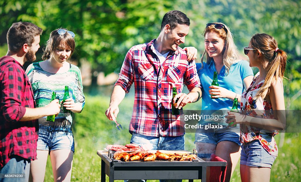 Group of friends on a barbecue picnic.