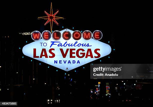 Welcome sign is seen on April 4, 2014 in Las Vegas, United States. With the replica of the Effiel Tower located outside the Paris Las Vegas hotel &...