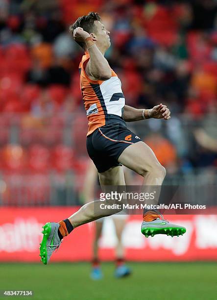 Rhys Palmer of the Giants celebrates kicking a goal during the round 19 AFL match between the Greater Western Sydney Giants and the Essendon Bombers...