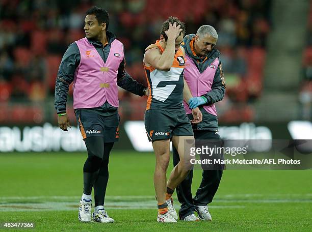 Stephen Coniglio of the Giants walks from the field during the round 19 AFL match between the Greater Western Sydney Giants and the Essendon Bombers...