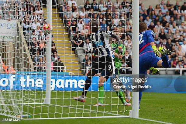 Papiss Demba Cisse of Newcastle United scores their first and equalising goal during the Barclays Premier League match between Newcastle United and...