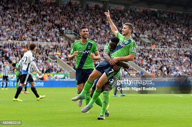 Shane Long of Southampton celebrates with Victor Wanyama and Graziano Pelle as he scores their second goal during the Barclays Premier League match...