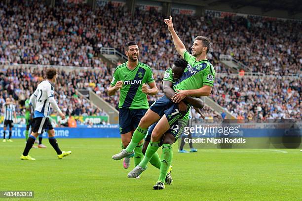 Shane Long of Southampton celebrates with Victor Wanyama and Graziano Pelle as he scores their second goal during the Barclays Premier League match...