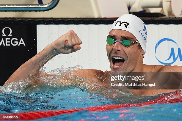 Camille Lacourt of France celebrates winning the gold medal after the Men's 50m Backstroke Final on day sixteen of the 16th FINA World Championships...