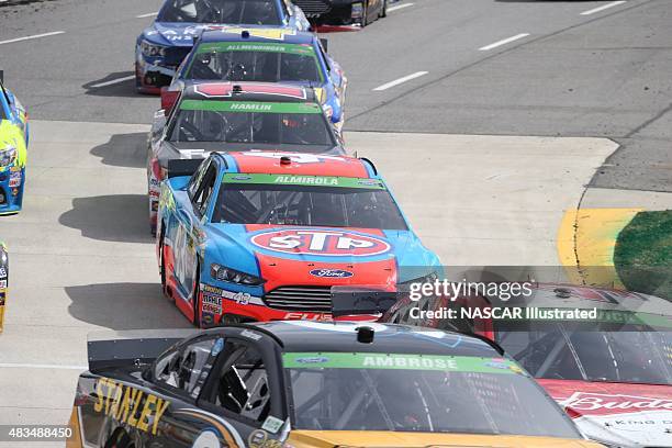 Cars on track during the running of the STP Gas Booster 500 at the Martinsville Speedway in Martinsville, VA. Picture taken on March 30, 2014 in the...