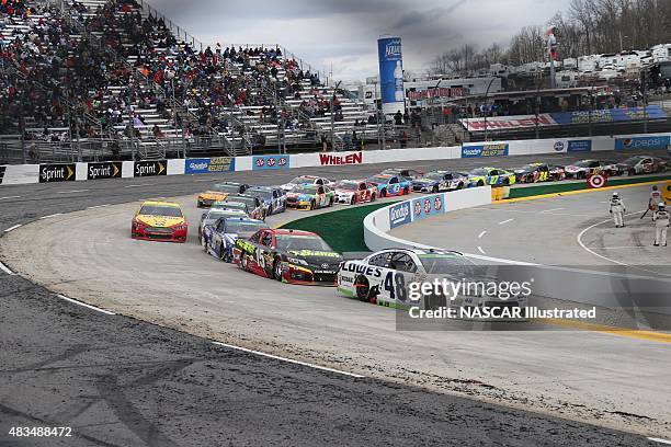 Cars on track during the running of the STP Gas Booster 500 at the Martinsville Speedway in Martinsville, VA. Picture taken on March 30, 2014 in the...