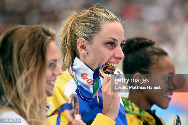 Gold medallist Jennie Johansson of Sweden poses with silver medallist Alia Atkinson of Jamaica and bronze medallist Yuliya Efimova of Russia during...