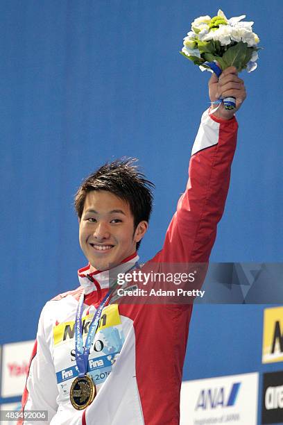 Gold medallist Daiya Seto of Japan celebrates during the medal ceremony for the Men's 400m Individual Medley Final on day sixteen of the 16th FINA...