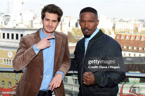 Andrew Garfield and Jamie Foxx pose at a photocall for 'The Amazing Spider-Man 2' at The Park Plaza Westminster Bridge Hotel on April 9, 2014 in...