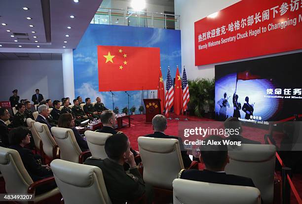 Secretary of Defense Chuck Hagel watches a short film about the Non-Commissioned Officer Academy during a tour April 9, 2014 in Changping District of...