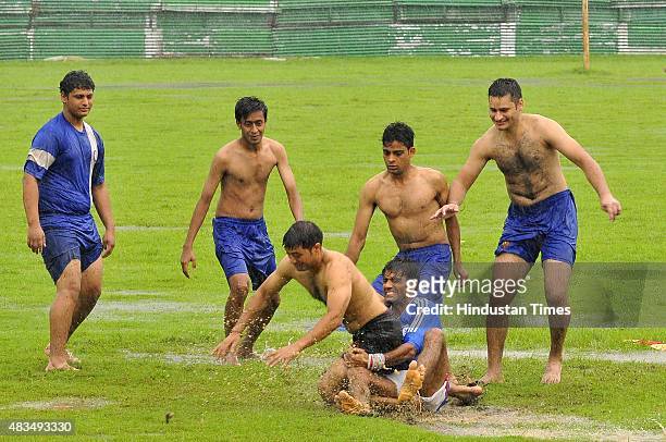 Youth playing kabaddi during pleasant weather rainfall on August 9, 2015 in Noida, India. Heavy rains caused major waterlogging in many areas,...