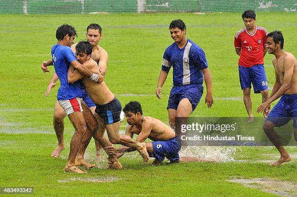 Youth playing kabaddi during pleasant weather rainfall on August 9, 2015 in Noida, India. Heavy rains caused major waterlogging in many areas,...