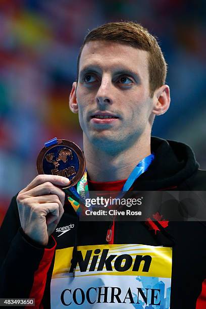 Bronze medallist Ryan Cochrane of Canada poses during the medal ceremony for the Men's 1500m Freestyle Final on day sixteen of the 16th FINA World...