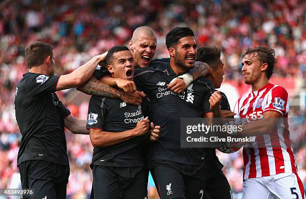 Philippe Coutinho of Liverpool celebrates with team mates James Milner, Martin Skrtel, Emre Can and Roberto Firmino of Liverpool as he scores their...