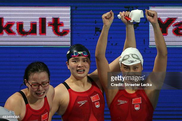 Yuanhui Fu , Jinglin Shi and Ying Lu of China celebrate after winning the gold medal in the Women's 4x100m Medley Relay Final on day sixteen of the...