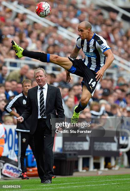 Steve McLaren manager of Newcastle United looks on as Gabriel Obertan of Newcastle United jumps for the ballduring the Barclays Premier League match...