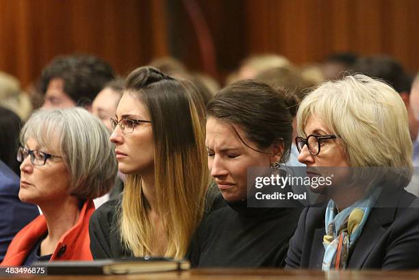 Aimee Pistorius is overcome with emotion as she listens to her brother Oscar's testimony in the Pretoria High Court on April 9 in Pretoria, South...