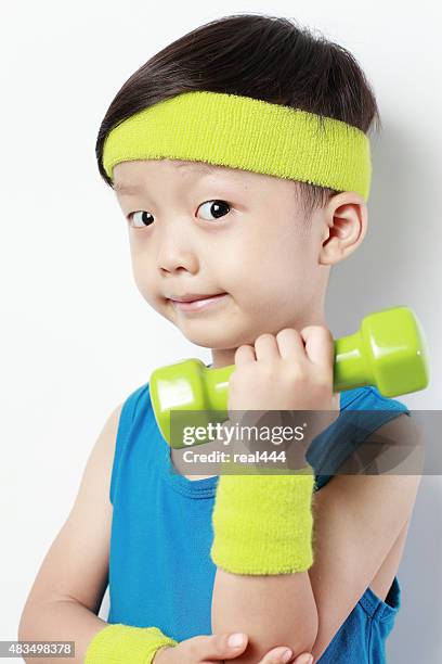 cute little boy lifting weights - headband stock pictures, royalty-free photos & images