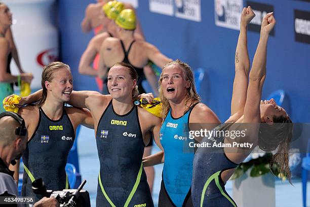 Louise Hansson, Sarah Sjostrom, Michelle Coleman and Jennie Johansson of Sweden celebrate winning the silver medal in the Women's 4x100m Medley Relay...