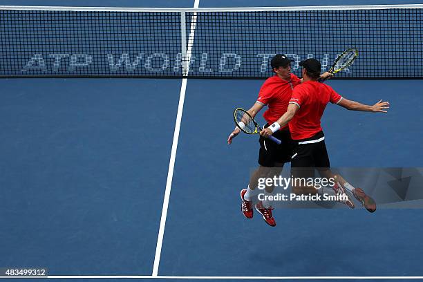 Doubles teammates Mike Bryan and Bob Bryan celebrate after defeating Ivan Dodig of Croatia and Marcelo Melo of Brazil in the men's double final...