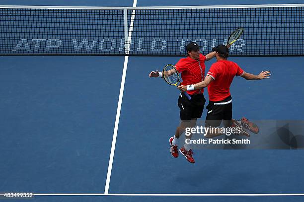 Doubles teammates Mike Bryan and Bob Bryan celebrate after defeating Ivan Dodig of Croatia and Marcelo Melo of Brazil in the men's double final...