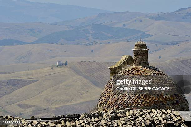 Picture taken on August 8, 2015 shows the small town of Craco, near Potenza. Due to a landslide, the inhabitants of the town of Craco were evacuated...