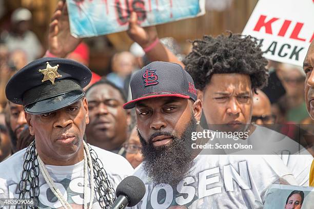 Michael Brown Sr. Addresses the crowd in the center of Canfield Street, where Michael Brown Jr. Was killed, during a memorial service marking the...