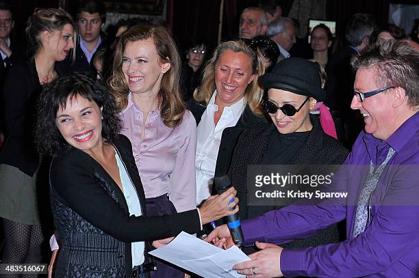 Saida Jawad , Valerie Trierweiler and Laam attend the Secours Populaire Francais charity party at the Musee Des Arts Forains on March 28, 2014 in...