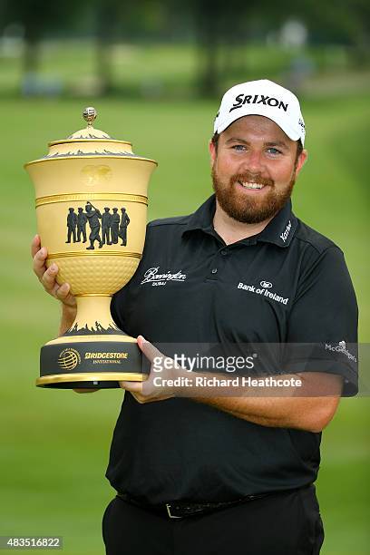 Shane Lowry of Ireland holds the Gary Player Cup after winning the World Golf Championships - Bridgestone Invitational during the final round at...