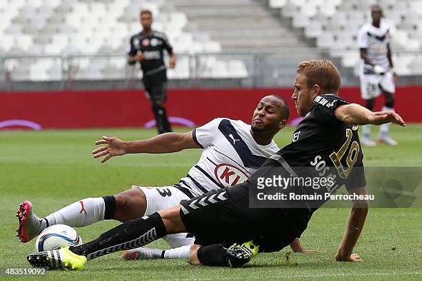 Thomas Toure and Alexi Peuget during the French Ligue 1match between FC Girondins de Bordeaux and Stade de Reims at Nouveau Stade Bordeaux on August...