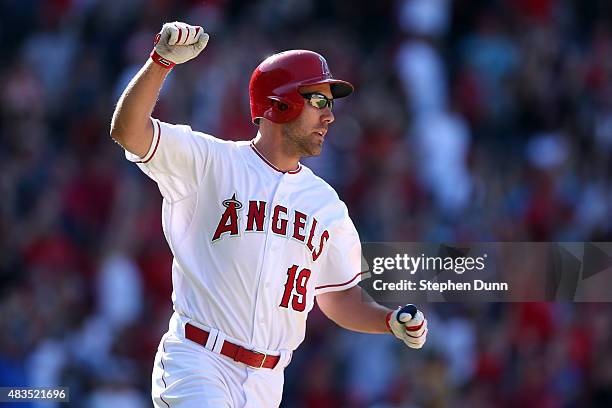 David Murphy of the Los Angeles Angels of Anaheim celebrates as he runs to first base after hitting a walk off RBI single in the 11th inning against...