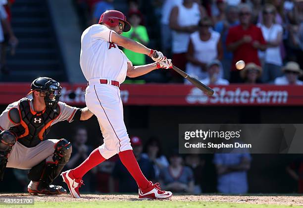 David Murphy of the Los Angeles Angels of Anaheim hits a walk off RBI single in the 11th inning against the Baltimore Orioles at Angel Stadium of...