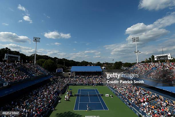 Kei Nishikori of Japan serves a shot to John Isner of the United States in the men's singles final during the Citi Open at Rock Creek Park Tennis...