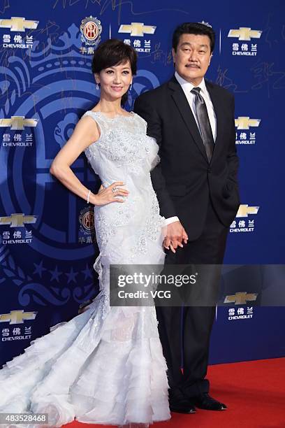 Actress Angie Chiu and her husband Melvin Wong pose on the red carpet during 17th Huading Awards on August 9, 2015 in Shanghai, China.