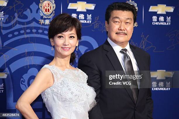Actress Angie Chiu and her husband Melvin Wong pose on the red carpet during 17th Huading Awards on August 9, 2015 in Shanghai, China.