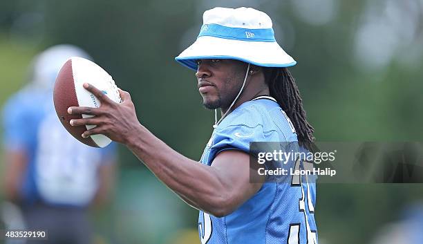 Joique Bell of the Detroit Lions waves to the fans during training camp on August 8, 2015 at the Detroit Lions Training Center in Allen Park,...