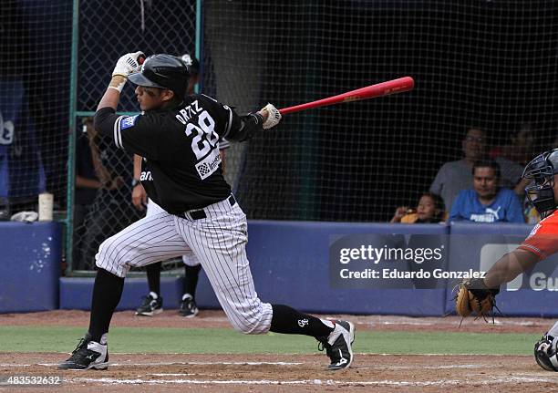 Alex Ortiz of Guerreros de Oaxaca homers during a match between Tigres de Quintana Roo and Guerreros de Oaxaca as part of Mexican Baseball League...