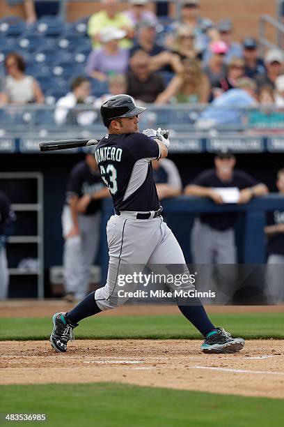 Jesus Montero of the Seattle Mariners makes some contact at the plate during the game against the San Diego Padres at Peoria Sports Complex on...