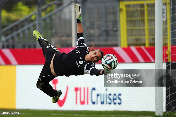 Goalkeeper Nadine Angerer makes a save during a Germany training session at Carl-Benz-Stadion on April 9, 2014 in Mannheim, Germany.