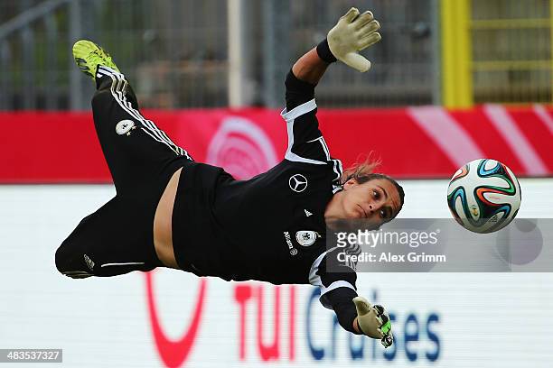Goalkeeper Nadine Angerer makes a save during a Germany training session at Carl-Benz-Stadion on April 9, 2014 in Mannheim, Germany.