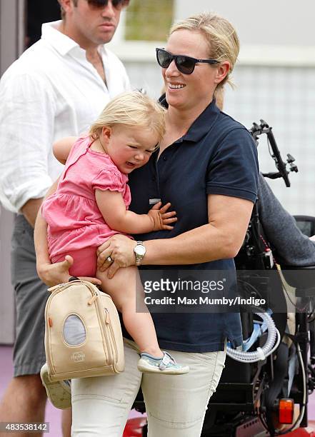 Zara Phillips carries daughter Mia Tindall as she attends day 3 of the Festival of British Eventing at Gatcombe Park on August 9, 2015 in Stroud,...