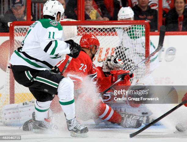 Anton Khudobin of the Carolina Hurricanes goes down in the crease to make a save on the puck shot by Dustin Jeffrey of the Dallas Stars during their...