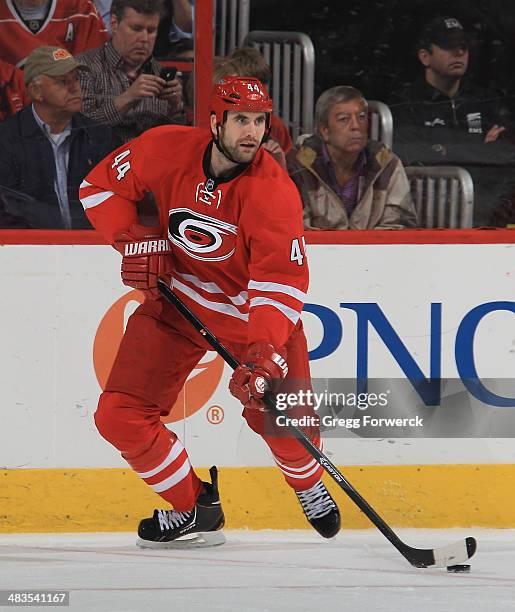 Jay Harrison of the Carolina Hurricanes looks to pass the puck during their NHL game against the Dallas Stars at PNC Arena on April 3, 2014 in...